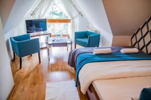 Cama o camas de una habitación en Wilcznik 10