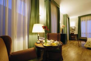 a hotel room with a table with food on it at Zunica Ospitalità dal 1880 in Civitella del Tronto