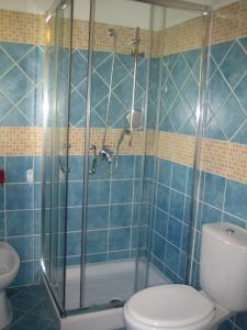 Koupelna v ubytování Albergo Villamarina + 9 fotografií