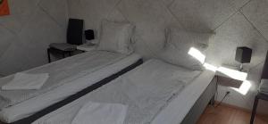 Postel nebo postele na pokoji v ubytování Haramara