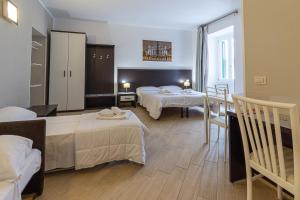 Posteľ alebo postele v izbe v ubytovaní B&B A Picture of Rome