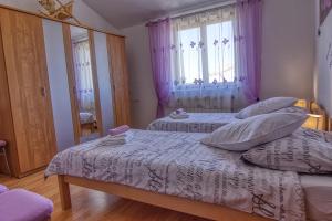Postel nebo postele na pokoji v ubytování Apartment Nela