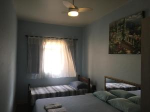 
Кровать или кровати в номере Hostel Vergueiro
