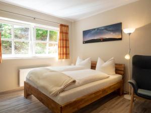 Ένα ή περισσότερα κρεβάτια σε δωμάτιο στο Haus Seeschwalbe