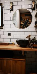 a bathroom with a black sink and a mirror at OH ! MADIANA in Saint-Jean-dʼIllac +34 photos