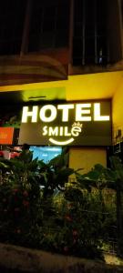 a hotel sign on the side of a building at Smile Hotel Chow Kit PWTC in Kuala Lumpur