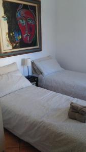 Posteľ alebo postele v izbe v ubytovaní Bouganville A apartament B&B