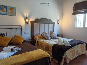 Posteľ alebo postele v izbe v ubytovaní Casa Rural Villa Mara + 19 fotografií
