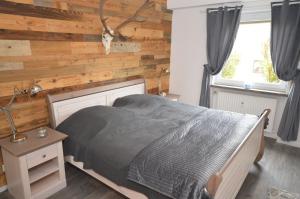 En eller flere senge i et værelse på Harzfeuer Bergblick