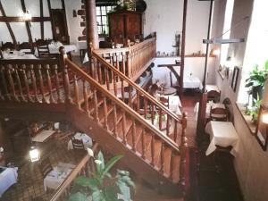 an overhead view of a restaurant with a spiral staircase at Hotel-Restaurant Bibermühle GmbH in Tengen