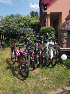 a group of bikes parked next to a house at Kasieńka in Żarnowska