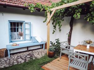a blue bench sitting in front of a house at Chaloupka Pálava in Pavlov