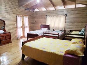 Postel nebo postele na pokoji v ubytování Villas Las Neblinas