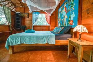 Postel nebo postele na pokoji v ubytování Casitas Las Flores
