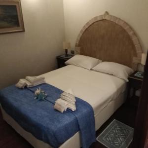 Postel nebo postele na pokoji v ubytování Home Mare Turchese