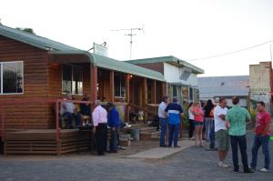 a group of people standing outside of a building at Ivanhoe Hotel Motel in Ivanhoe