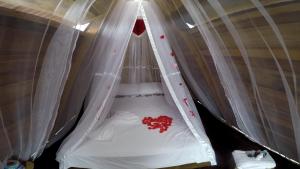 Кровать или кровати в номере Mana Star Lounge Hotel