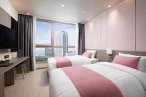 Ein Bett oder Betten in einem Zimmer der Unterkunft Utop Boutique Hotel&Residence