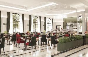 a restaurant with tables and chairs in a building at Thiên Ân Hotel Bắc Giang in Bắc Giang