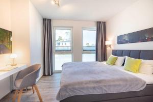 Ένα ή περισσότερα κρεβάτια σε δωμάτιο στο Appartement "Wolkenschiff" - Oase am Haff