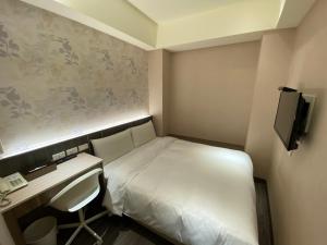 TV a/nebo společenská místnost v ubytování Chair Man Hotel