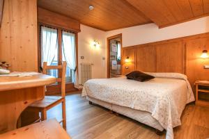 Postel nebo postele na pokoji v ubytování Albergo Adele
