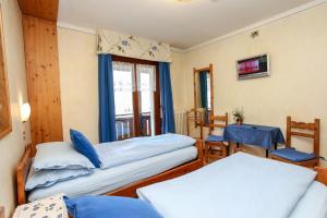 Postel nebo postele na pokoji v ubytování Albergo Adele