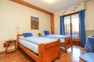 Postel nebo postele na pokoji v ubytování Albergo Adele