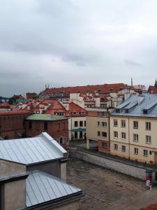 a view of a city with buildings and roofs at Hotel Ester in Kraków