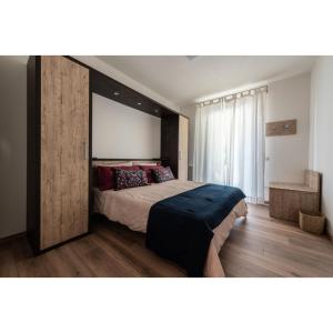 A bed or beds in a room at Le Due Torri