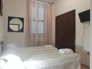 Postel nebo postele na pokoji v ubytování Hotel La Torretta