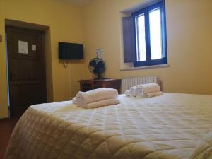 Casa per Ferie Ulivo d'Assisi客房内的一张或多张床位