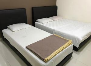 Postel nebo postele na pokoji v ubytování Hotel 3Winz, Chow Kit Hospital Kuala Lumpur
