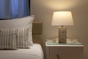 Posteľ alebo postele v izbe v ubytovaní Kite Blue Villas