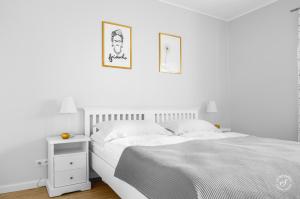 A bed or beds in a room at Agrodomek - komfortowy Apartament na Górnym Śląsku
