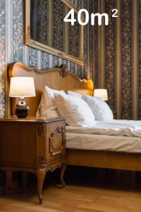 Ένα ή περισσότερα κρεβάτια σε δωμάτιο στο Vintage Senacka 5 Apartments