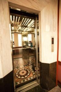 a hallway with a room with a tile floor at Hanoi Street Hotel in Hanoi