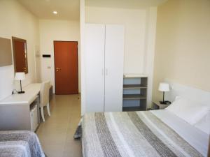 Кровать или кровати в номере Hotel Jonio