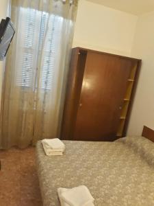 Postel nebo postele na pokoji v ubytování Hotel La Torretta
