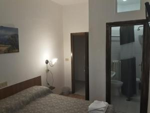 Postel nebo postele na pokoji v ubytování Hotel La Torretta
