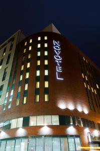 a building with a sign on the side of it at Novotel Liverpool Centre in Liverpool