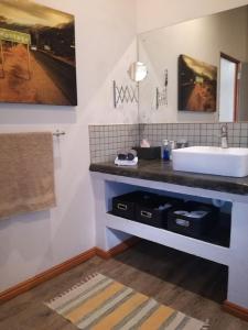 a bathroom with a sink and a counter top at Montagu Ronda-View in Montagu