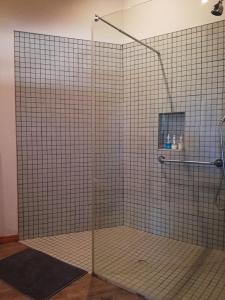 a shower with a glass door in a bathroom at Montagu Ronda-View in Montagu