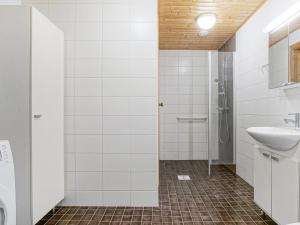 Ванная комната в Kotimaailma Apartments Oulu