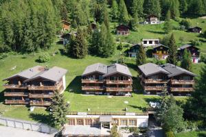 an aerial view of a resort with houses at Residence Edelweiss C331 in Bellwald