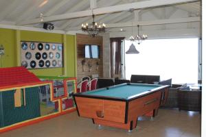 a room with a pool table and a ping pong ball at Divina Seaside Apartments by Estia in Gouves