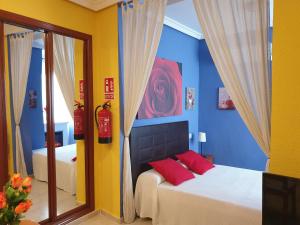 A bed or beds in a room at Apartamentos Dana Sol