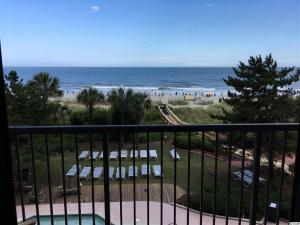 a view of the beach from the balcony of a condo at Beach Colony Ocean Front Executive Suite in Myrtle Beach