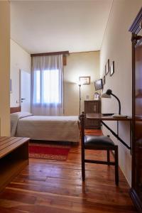 Postel nebo postele na pokoji v ubytování ALBERGO EUROPA