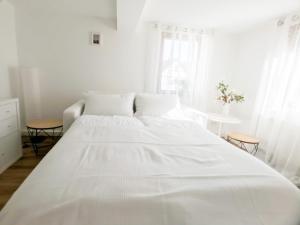 A bed or beds in a room at Dream Green Apartment 'Meadow'